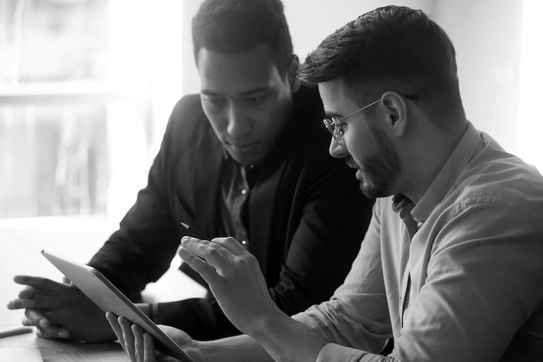 two people looking at laptop