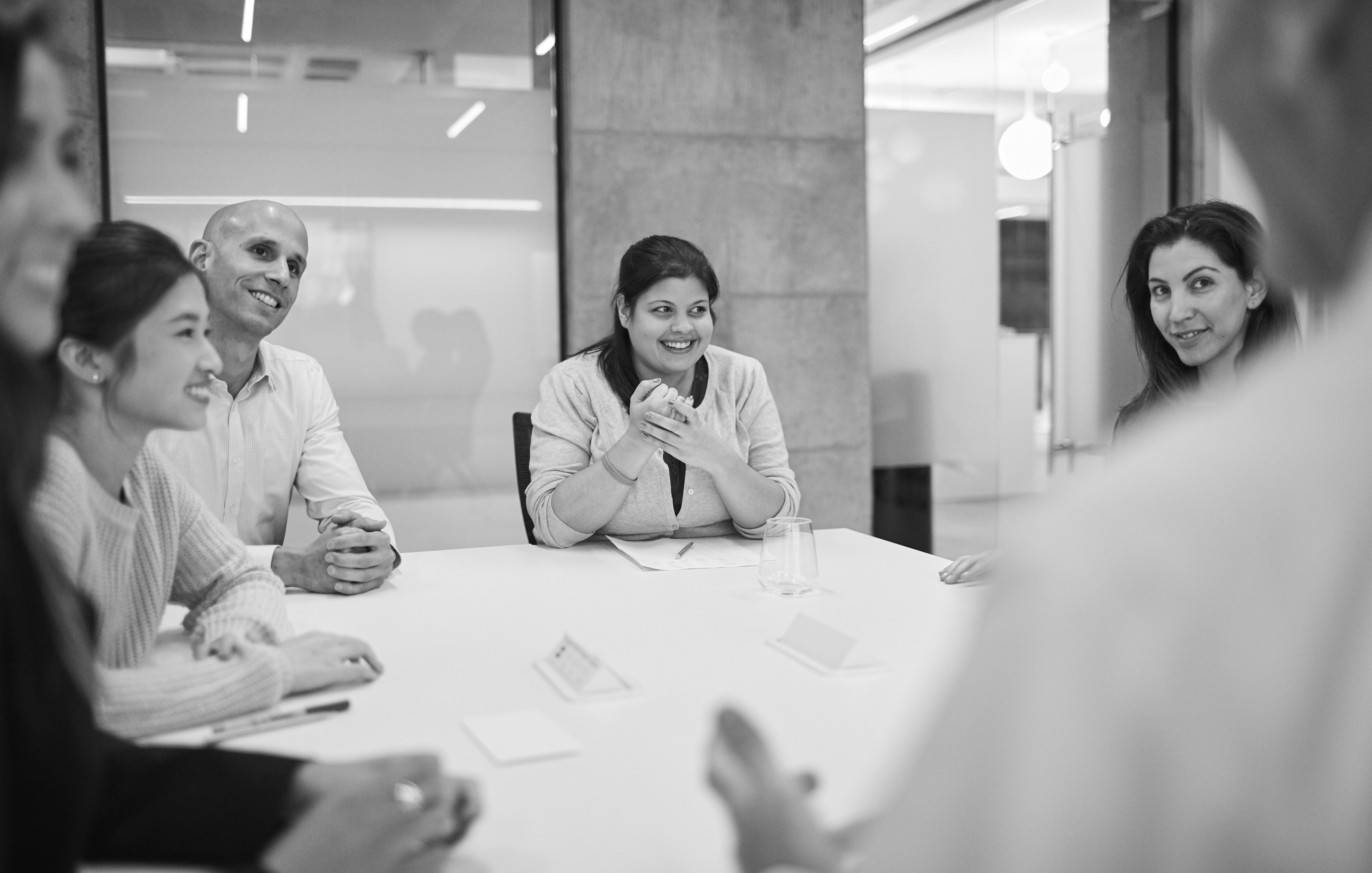 four people in conversation